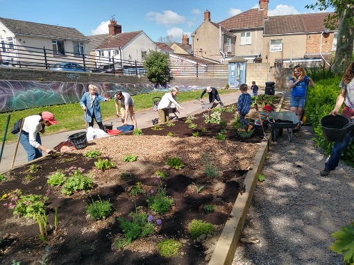 Parish volunteers planting a raised bed at Cambria Bridge Community Garden