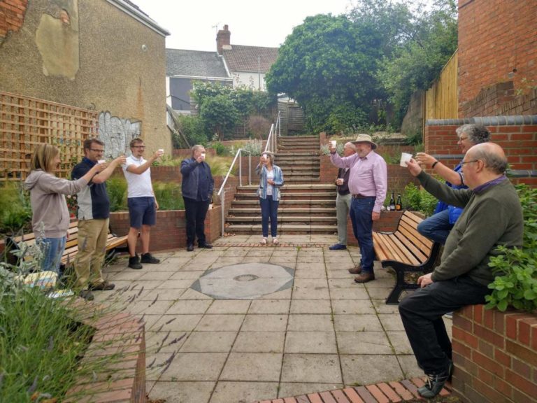 Parish Councillors toasting the completion of replanting the fishing for the moon garden