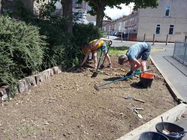 Parish volunteers planting a raised bed