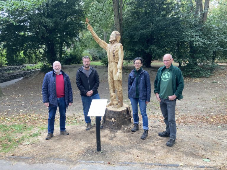 Councillors Chris Watts and Neil Hopkins at the opening of the Richard Jefferies Sculpture in the Town Gardens with volunteers from the Richard Jefferies Museum